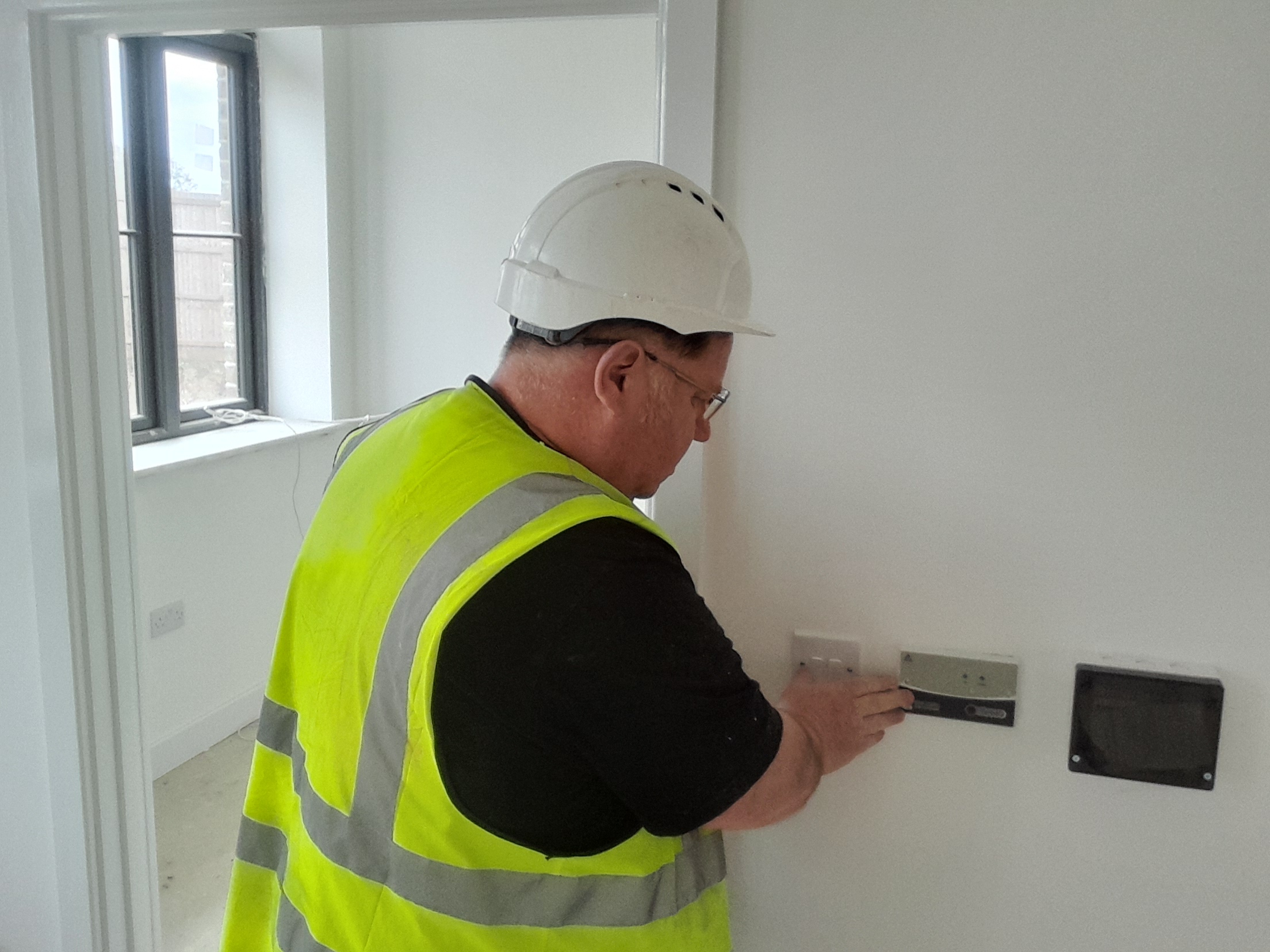 Gilly installing electrical sockets