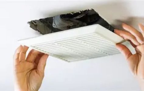 A new sleek bathroom fan being fitted